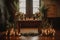 ceremony setup with candles, floral arrangements, and greenery on a wooden table