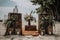 ceremony setup with wooden box, lanterns, and greenery for outdoor or beach wedding