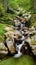 Ceresole Reale, Italy. Small waterfalls between the rocks of a mountain stream, near the Dres waterfall near Lake Ceresole.