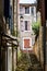 Cereste, France - June 17, 2018. Hidden street with lucern and traditional french provence architecture