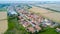 Certosa of Pavia, aerial view, village. Roofs and fields in the province of Pavia. Pavia, Lombardy, Italy