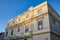 Cervantes Theater facade Malaga, Spain under the blue sky