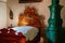 Cervena Lhota, South Bohemia, Czech Republic, 9 October 2021: Castle interior, priest`s bedroom, wood carved bed with divine eye