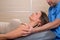 Cervical stretching therapy with therapist in woman neck