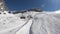 Cervinia, Italy. Skiers are moving to the top of the mountain with a chairlift. Skier point of view. Camera on helmet