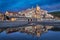 Cervo town reflecting in water at dusk, Liguria, Italy