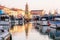 Cesenatico, Emilia Romagna, Italy, July 2020: Colourful fishing boat in the Leonardo`s canal harbor of Cesenatico