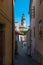 Cesky Krumlov city view in middle of the sunny day thru the little alley in town