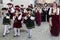 Cesky Krumlov, Czech Republic - June, 2017: Young musicians are walking and playing penny trumpets on Cesky Krumlov streets during