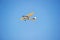 Cessna 152 fixed wing single engine aircraft in flight