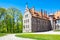 Cesvaine castle, green trees and blue sky