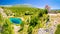 Cetina river source water hole and Orthodox church panoramic view