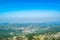 Cetinje city top landscape from viewpoint  Njegos mausoleum. Lovcen National Park. Montenegro. Summer blue montanian view