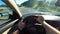 Cetinje, Montenegro - 01.08.2022 - Driver drives a car on a mountain highway in bright sunlight
