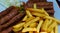 Cevapi or mici mititei with french fries or chips