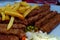Cevapi or mici mititei with french fries or chips