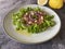 Ceviche. Fish dish from Peruvian cuisine with salmon, marinated lamb\\\'s lettuce, coriander, red onions, lime and peanuts.