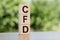 CFD - acronym from wooden blocks with letters, Contract For Difference CFD investment concept