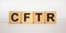 CFTR medical concept. Wooden cubes with the inscription `CFTR - cystic fibrosis transmembrane regulator`. Beautiful white