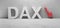 Cgi render illustration of the white word DAX infront of a white concrete wall, red down arrow
