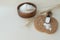 chain of ingredients for making bread: wheat ears, grain, flour on light background