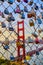 Chain link fence covered in locks with Golden Gate Bridge in distance