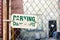 Chain link fence with sign on it