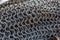 Chain-mail or Hauberk texture, metal protective armour of medieval or middle ages times, close up macro