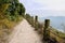 Chain rail and stone balusters along mountainside pavement in af