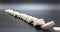 Chain reaction  built figure of dominoes falling in slow motion