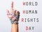 Chained fist hand point finger with WORLD HUMAN RIGHTS DAY text