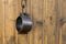 Chained iron shackles traditional handcuffs on wooden background copy space