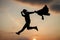 chained to the sky. personal achievement goal. man silhouette jump on sky background. confident businessman running