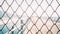Chainlink fence. Wire fence. Metal net. Wire mesh. Metal grater grille background