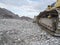 Chains of a bulldozer in the empty Forggen lake