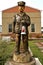 Chainsaw carving with a brakeman holding a red kerosine lantern