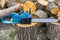 Chainsaw. Close-up of woodcutter sawing chain saw. Close up professional chainsaw blade cutting log of wood. Chainsaw bar