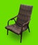 chair armchair, with a back upholstered in material, on a green background