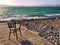 Chair on beach of Sea of Galilee lake