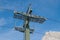 Chair lift gear and steel structure of a pylon against blue sky and high mountains