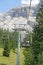 Chair lift people up towards the top of the Dolomites