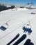 Chair lift shadows on snow