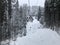 Chair lift in the winter for skiers. Cableway in the mountains with skiers. Snowy forest in the Carpathians, skiing. Winter climb