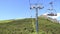 Chair lifts with and without tourists moving up and down in the mountains in Slovakia