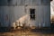 a chair sits in front of a dilapidated house