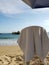 chair to rest with a white towel on the sand of the beach of Acapulco, Mexico on a sunny day