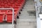 A chair for watching sports on the amphitheater. Chairs lined up in the stands.