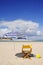 Chair, water bottle, ball on the beach