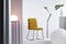 Chair on white platform in fashionable abstract interior