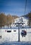 Chairlift (aerial lift) and skilift in sunny day